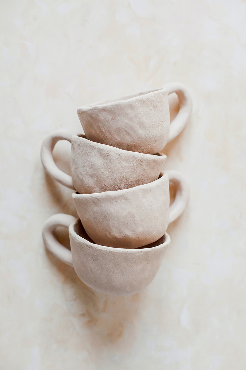 stacked white clay cups