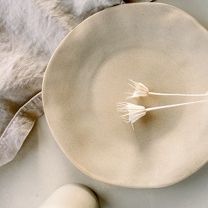 simple beige plate with dry flowers